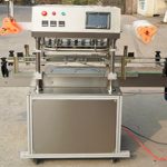 Automatinė trijų galvų užkandžių stiklainių plėvelės sandarinimo mašina