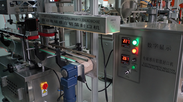 aluminum induction foil sealing machine sandarinimo mašina automatinė.jpg
